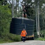 pick-and-carry-crane-moving-water-tank Pick and Carry Crane Moving Water Tank