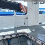 franna taxi crane assisting with barge engine maintenance