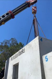 franna taxi crane lifting concrete tanks during installation brisbane qld