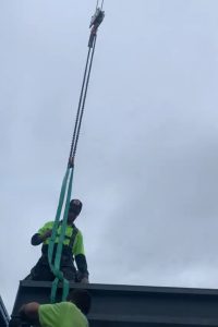 slewing crane assisting in house build beam installation brisbane qld